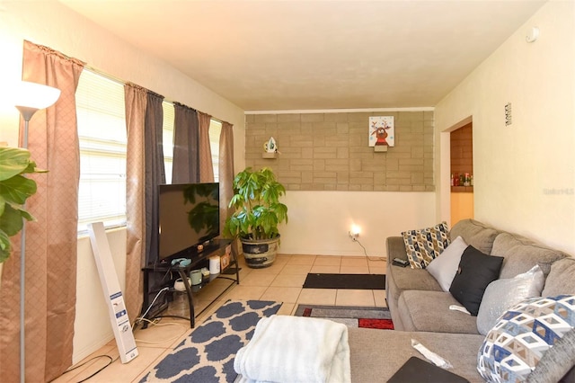 tiled living room featuring a healthy amount of sunlight