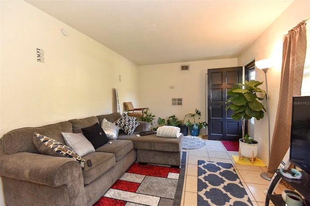 living room with light tile patterned floors