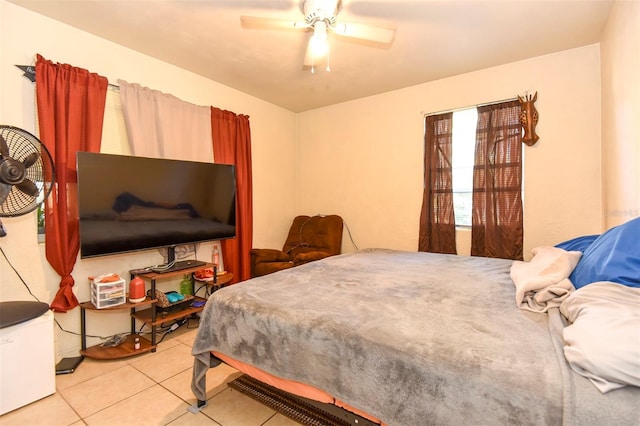 bedroom featuring ceiling fan and light tile patterned flooring