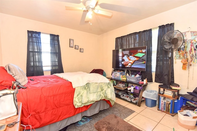 bedroom featuring ceiling fan and light tile patterned flooring