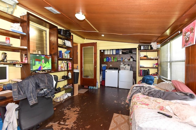 interior space with washing machine and dryer, vaulted ceiling, and wood ceiling