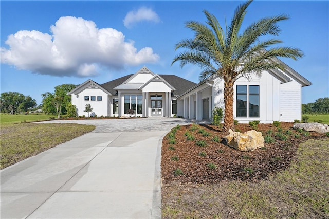 5040 SW 125th Cir, Archer, FL 32618 - view of front of house with concrete driveway and an attached garage