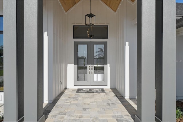 5040 SW 125th Cir, Archer, FL 32618 - property entrance featuring french doors and board and batten siding
