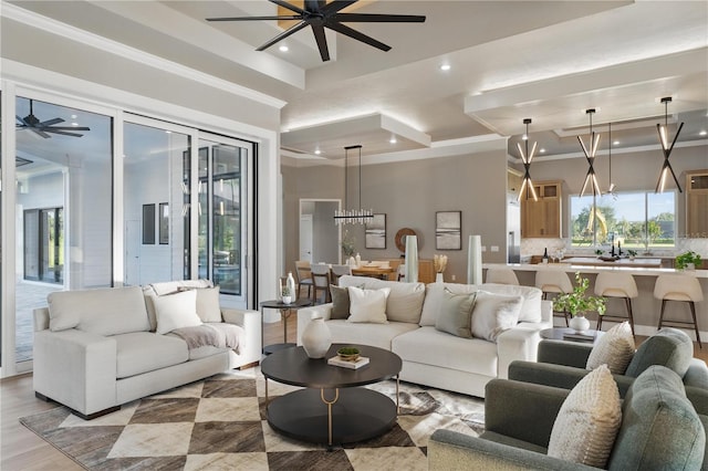 5040 SW 125th Cir, Archer, FL 32618 - living room featuring ceiling fan, recessed lighting, a chandelier, plenty of natural light, and light wood finished floors