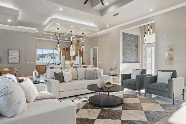 5040 SW 125th Cir, Archer, FL 32618 - living room featuring a tray ceiling, ornamental molding, recessed lighting, and a ceiling fan