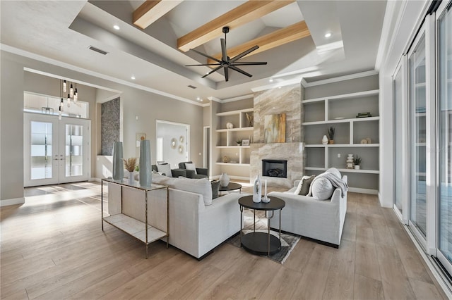5040 SW 125th Cir, Archer, FL 32618 - living area featuring french doors, recessed lighting, a premium fireplace, beamed ceiling, and a towering ceiling