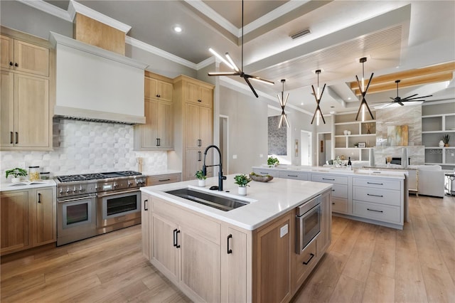 5040 SW 125th Cir, Archer, FL 32618 - kitchen featuring stainless steel appliances, ceiling fan, a kitchen island with sink, open floor plan, and custom exhaust hood