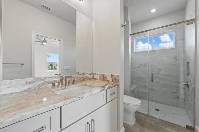 5040 SW 125th Cir, Archer, FL 32618 - bathroom with vanity, a marble finish shower, and a ceiling fan