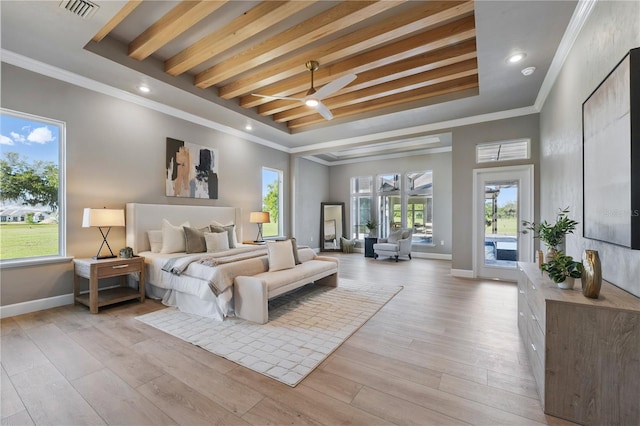 5040 SW 125th Cir, Archer, FL 32618 - bedroom featuring access to exterior, a tray ceiling, light wood-type flooring, ornamental molding, and recessed lighting