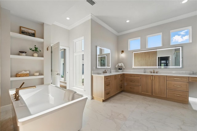 5040 SW 125th Cir, Archer, FL 32618 - bathroom with a soaking tub, built in shelves, crown molding, double vanity, and marble finish floors