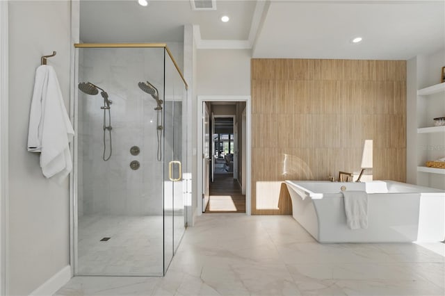 5040 SW 125th Cir, Archer, FL 32618 - bathroom featuring marble finish flooring, a freestanding tub, a stall shower, and recessed lighting