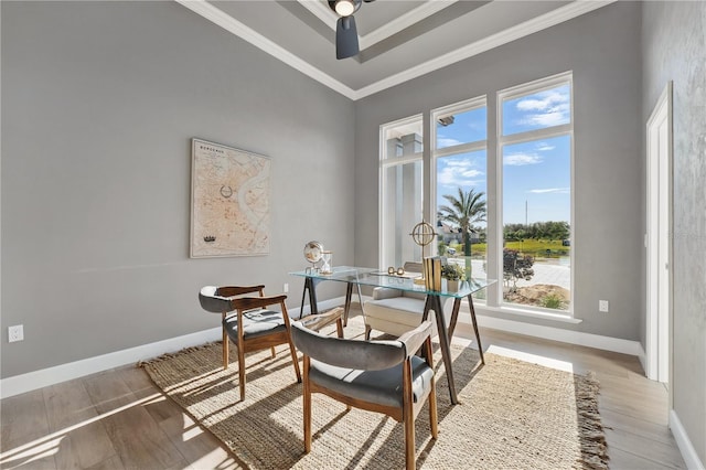 5040 SW 125th Cir, Archer, FL 32618 - dining space featuring wood finished floors, ceiling fan, and ornamental molding