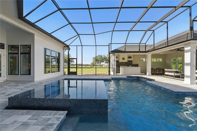 5040 SW 125th Cir, Archer, FL 32618 - view of pool featuring exterior kitchen, a patio, a lanai, and a ceiling fan