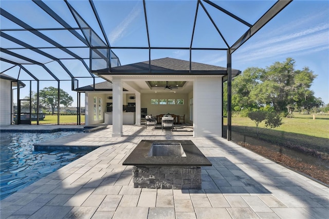 5040 SW 125th Cir, Archer, FL 32618 - view of patio with ceiling fan, an outdoor fire pit, a lanai, and an outdoor pool