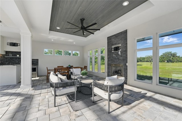 5040 SW 125th Cir, Archer, FL 32618 - view of patio with an outdoor living space with a fireplace and a ceiling fan