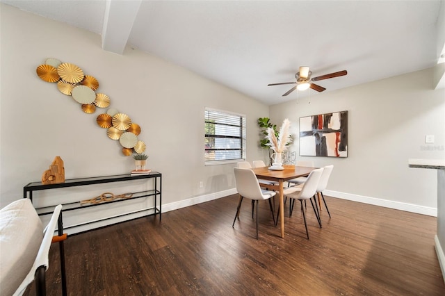 dining room featuring lofted ceiling with beams, ceiling fan, and dark wood-type flooring