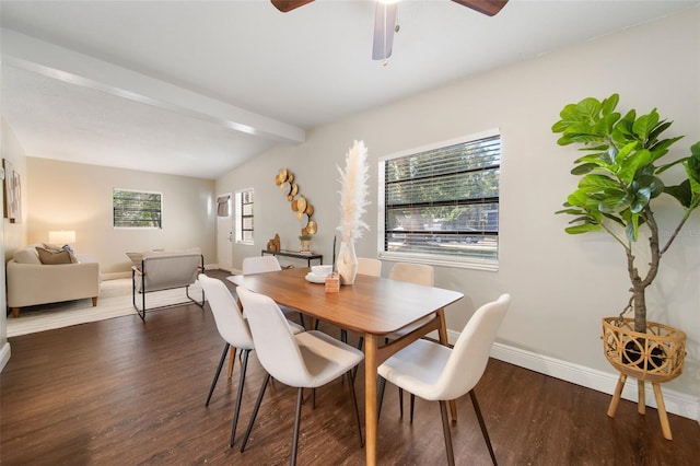 dining space with vaulted ceiling with beams, ceiling fan, and dark wood-type flooring