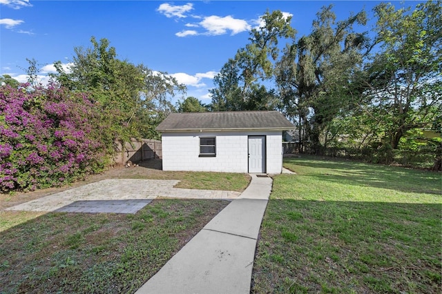 view of outdoor structure with a lawn