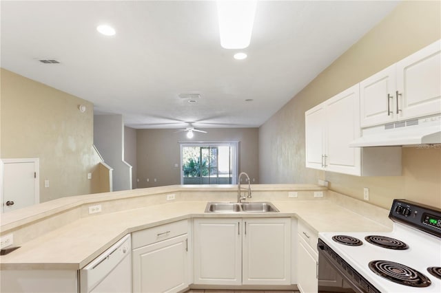 kitchen featuring kitchen peninsula, sink, and white appliances