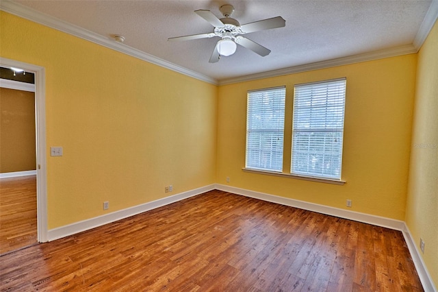 unfurnished room featuring ceiling fan, hardwood / wood-style floors, a textured ceiling, and ornamental molding