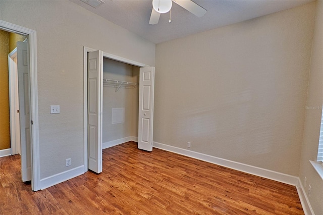4715 SW 91st Dr Unit 305, Gainesville, FL 32608 - unfurnished bedroom with light wood-type flooring, a closet, and a ceiling fan
