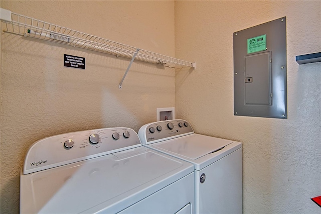4715 SW 91st Dr Unit 305, Gainesville, FL 32608 - washroom featuring electric panel and washing machine and dryer