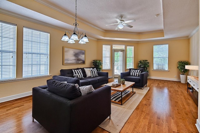 4715 SW 91st Dr Unit 305, Gainesville, FL 32608 - living area with a raised ceiling, crown molding, light wood-type flooring, a textured ceiling, and ceiling fan