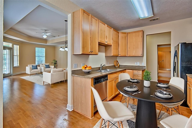 4715 SW 91st Dr Unit 305, Gainesville, FL 32608 - kitchen featuring a ceiling fan, dishwasher, light wood-type flooring, and dark countertops