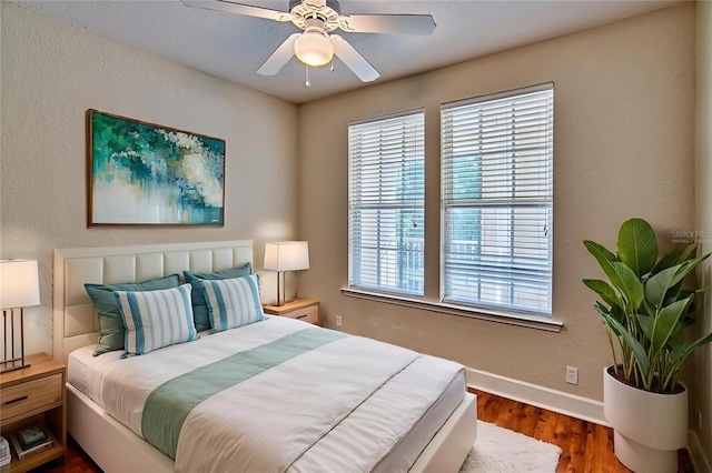 4715 SW 91st Dr Unit 305, Gainesville, FL 32608 - bedroom featuring wood finished floors and ceiling fan