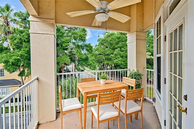 4715 SW 91st Dr Unit 305, Gainesville, FL 32608 - balcony featuring ceiling fan and outdoor dining area