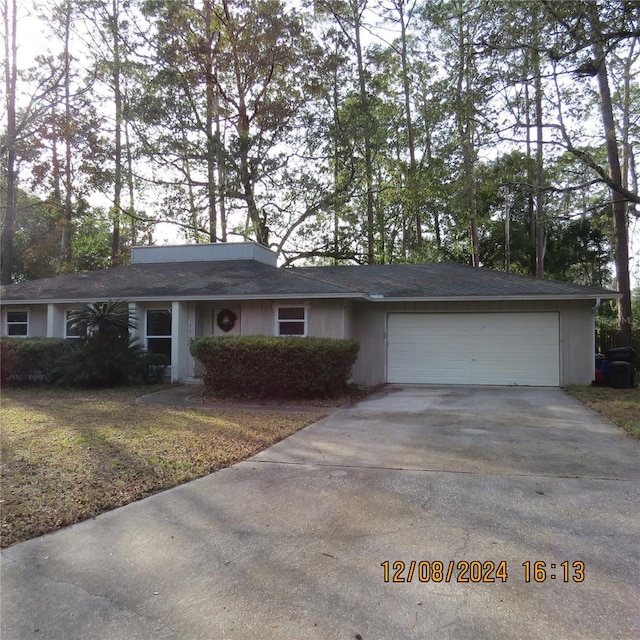 ranch-style house featuring a garage