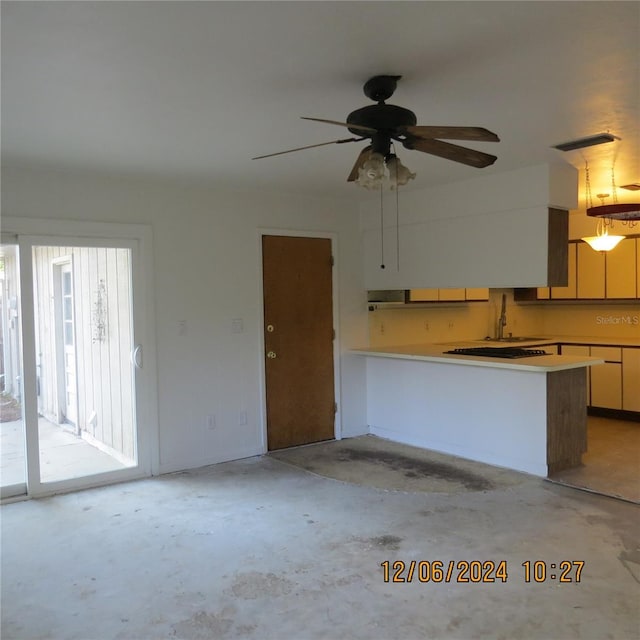 unfurnished living room featuring ceiling fan