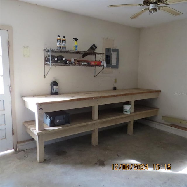 interior space featuring electric panel and ceiling fan