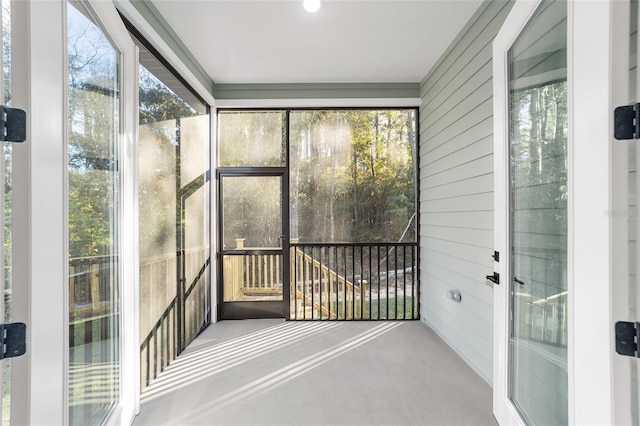 unfurnished sunroom with a wealth of natural light