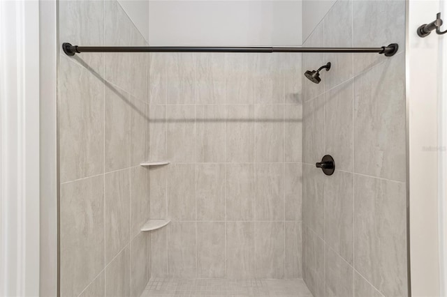 bathroom with a tile shower