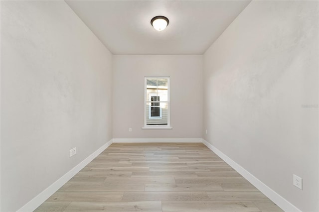 unfurnished room with light wood-type flooring