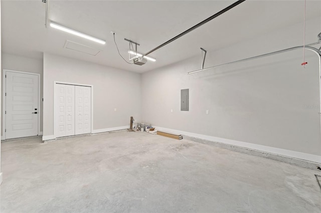 garage featuring electric panel and a garage door opener