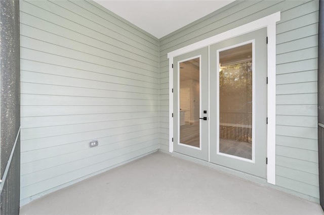 unfurnished sunroom featuring french doors