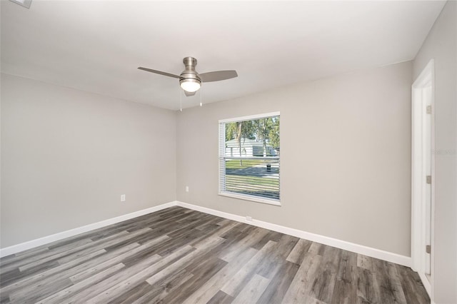 empty room featuring hardwood / wood-style flooring and ceiling fan