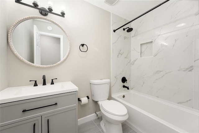 full bathroom featuring tile patterned floors, vanity, toilet, and tiled shower / bath