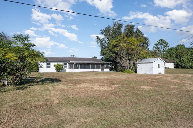 view of yard featuring a storage shed and a sunroom