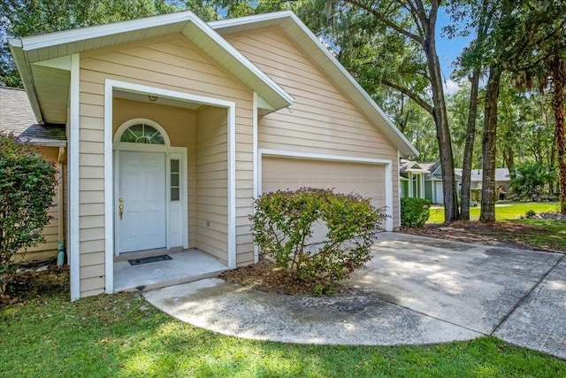 8309 SW 61st Pl, Gainesville, FL 32608 - doorway to property with an attached garage and concrete driveway