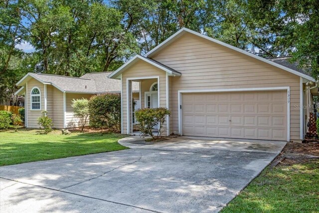 ranch-style home featuring a garage and a front yard