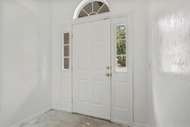 8309 SW 61st Pl, Gainesville, FL 32608 - foyer entrance with baseboards and unfinished concrete flooring