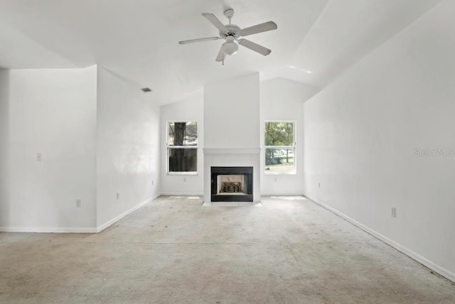 8309 SW 61st Pl, Gainesville, FL 32608 - unfurnished living room with a fireplace with flush hearth, baseboards, vaulted ceiling, carpet flooring, and ceiling fan