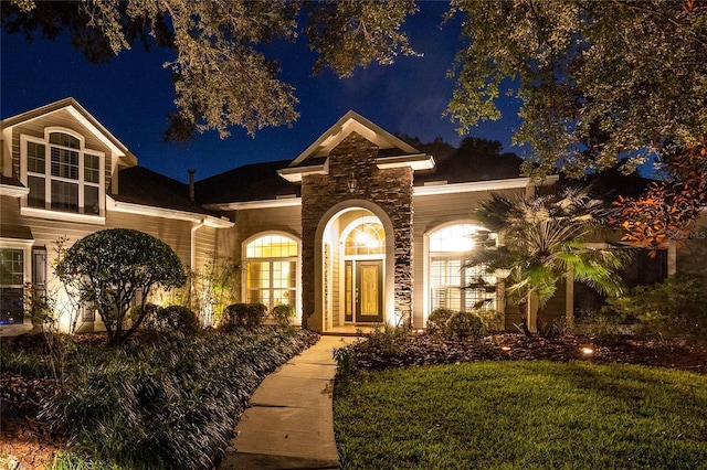 view of front of home with a lawn