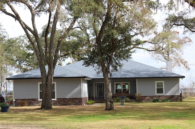 back of house with a lawn