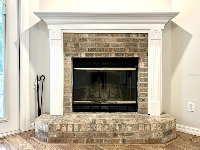 interior details with a fireplace and hardwood / wood-style floors