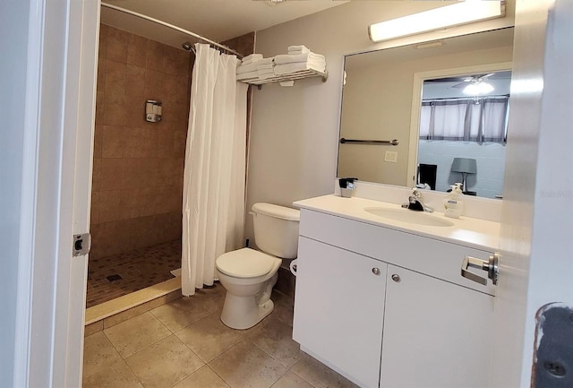 bathroom with tile patterned flooring, vanity, curtained shower, and toilet