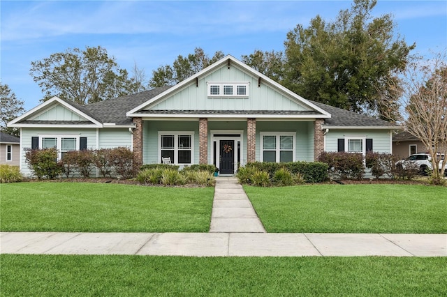 view of front of home with covered porch and a front yard